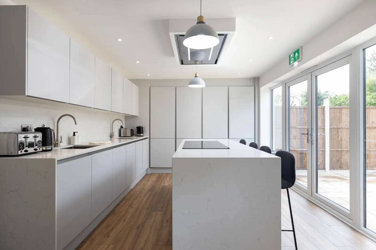 Fitted kitchen with central island and garden doors at 3 Burnell Avenue