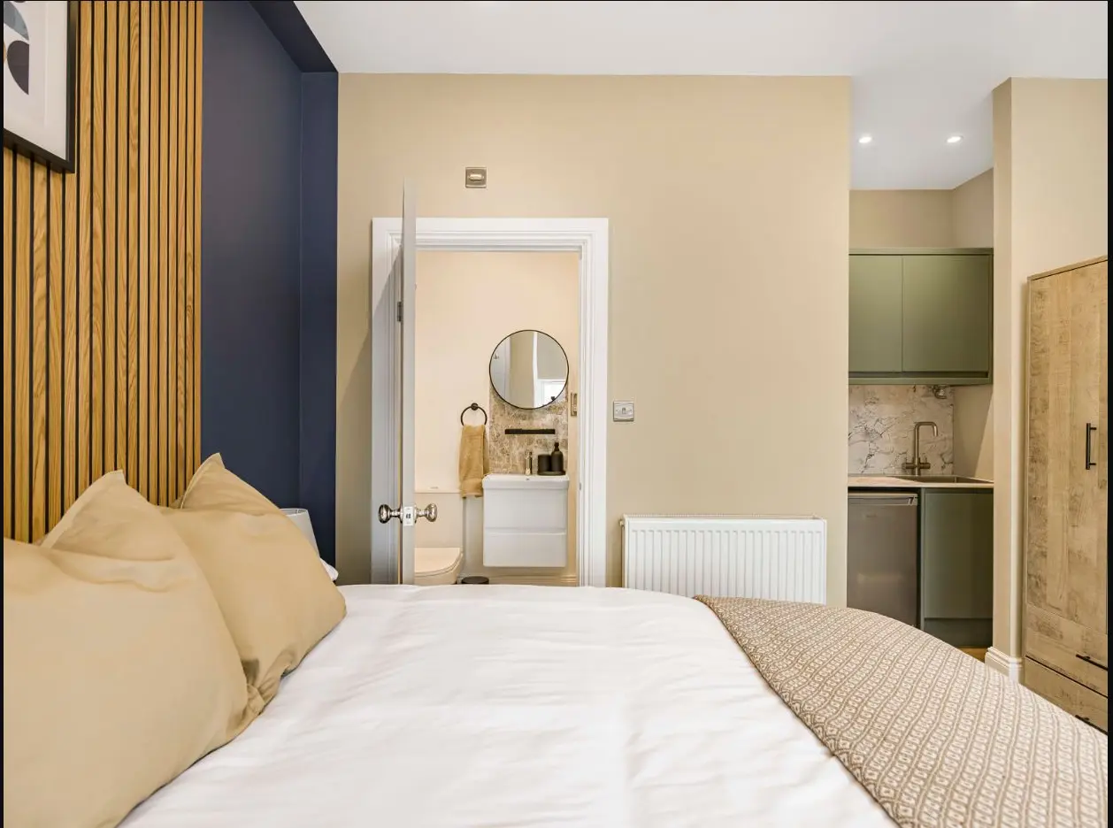 Furnished bedroom leading to an en-suite at 2 Essex Road
