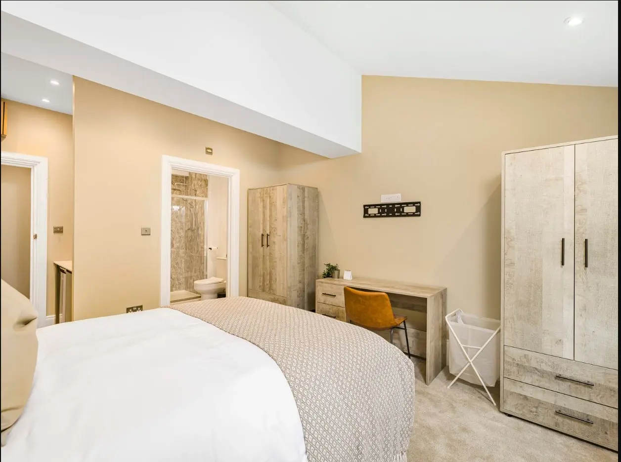 Spacious furnished bedroom with wardrobe at 2 Essex Road