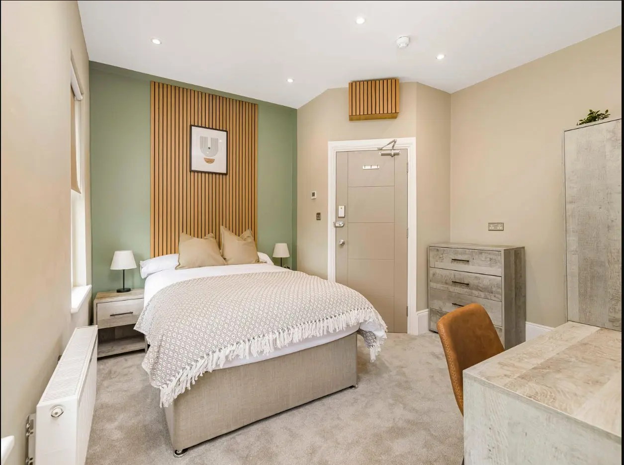 Bright furnished bedroom with workspace at 2 Essex Road