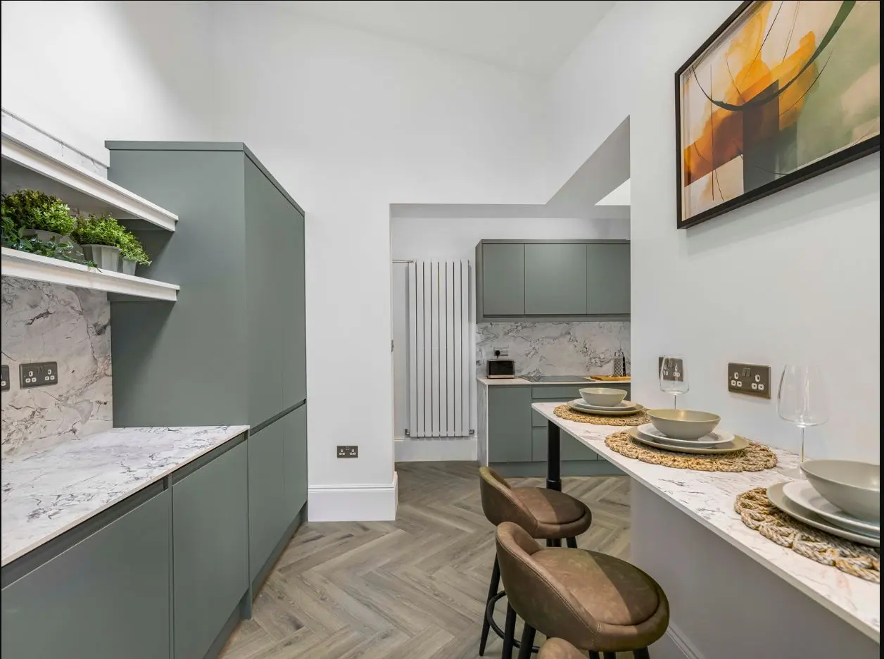 Modern shared kitchen and breakfast bar at 2 Essex Road